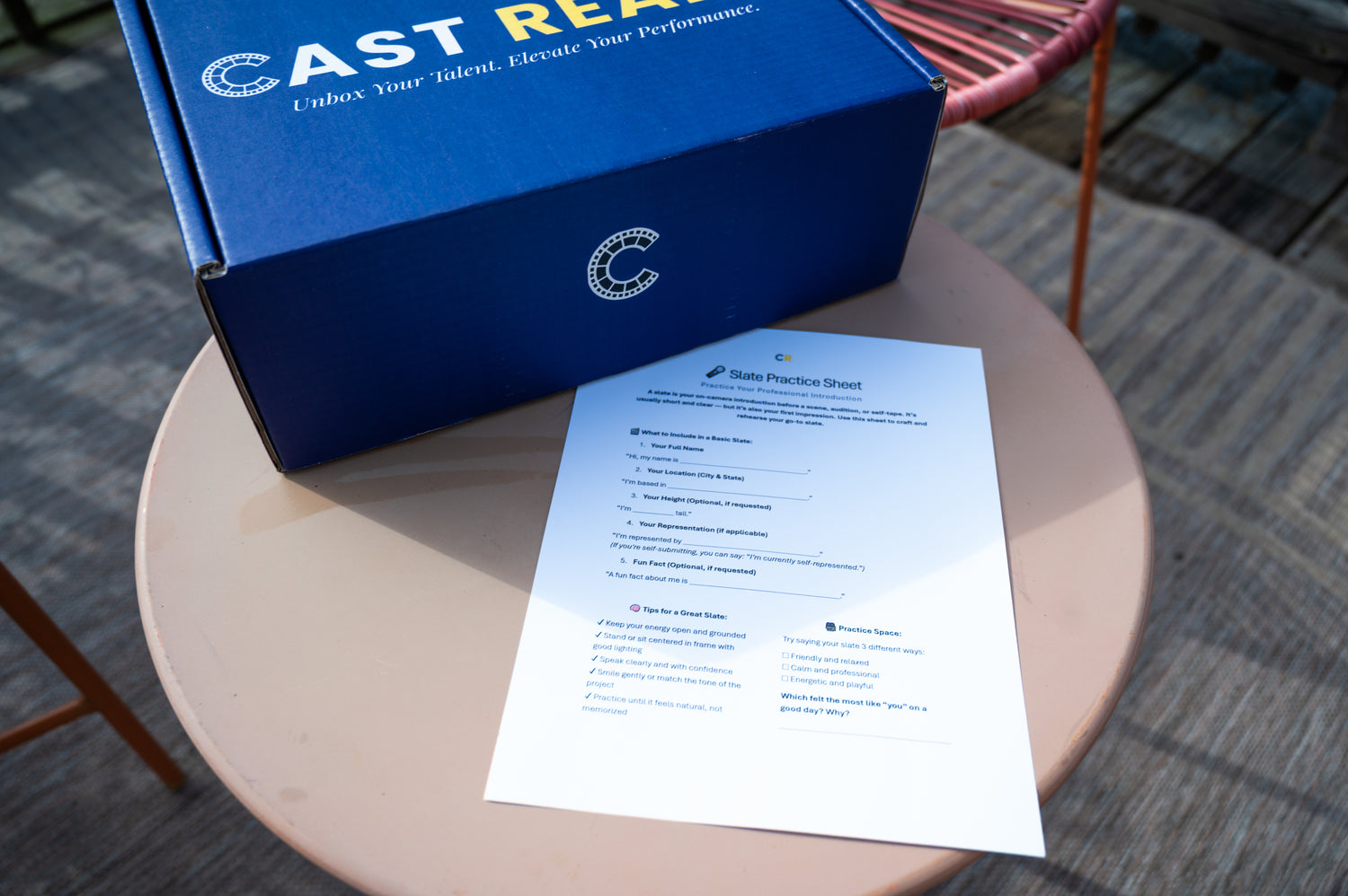 CastReady acting kit box and a slate practice sheet on a table, showing hands-on resources included for at-home acting practice