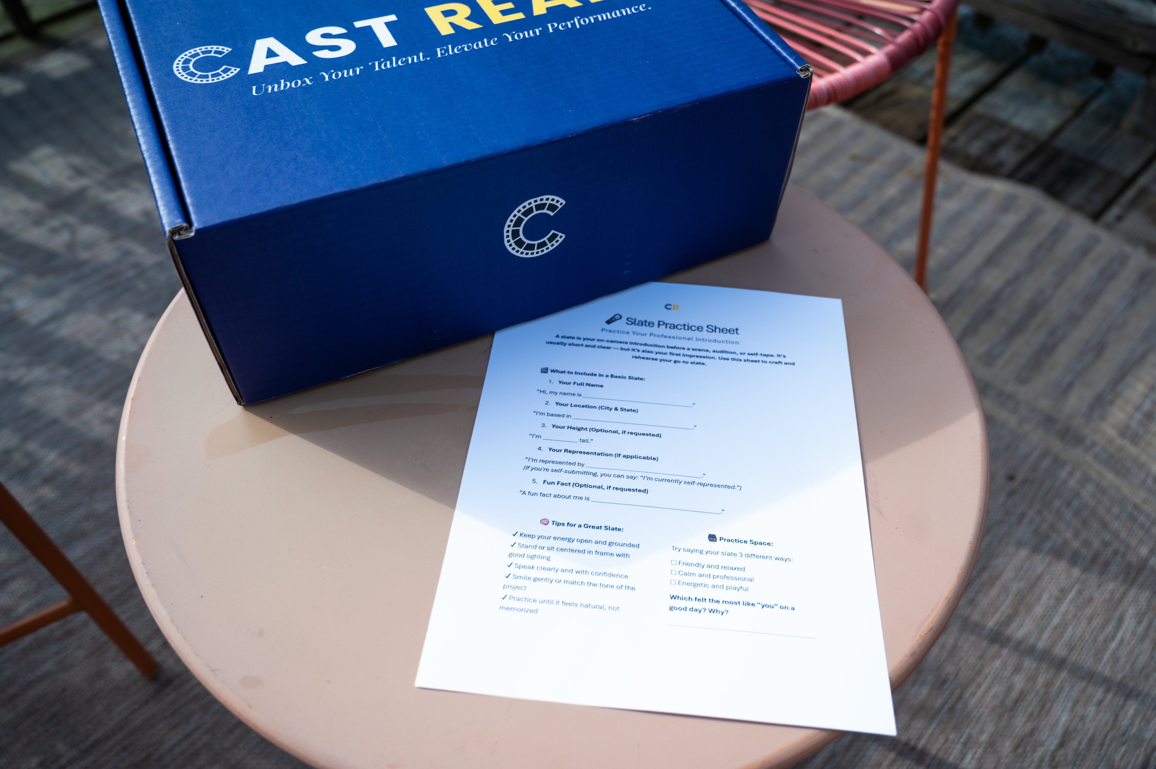 CastReady acting kit box and a slate practice sheet on a table, showing hands-on resources included for at-home acting practice